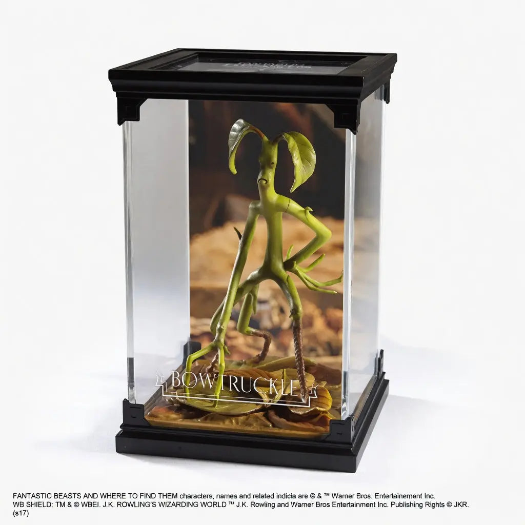 Detail feuilles sculptees expression bienveillante figurine Botruc Animaux Fantastiques Noble Collection
