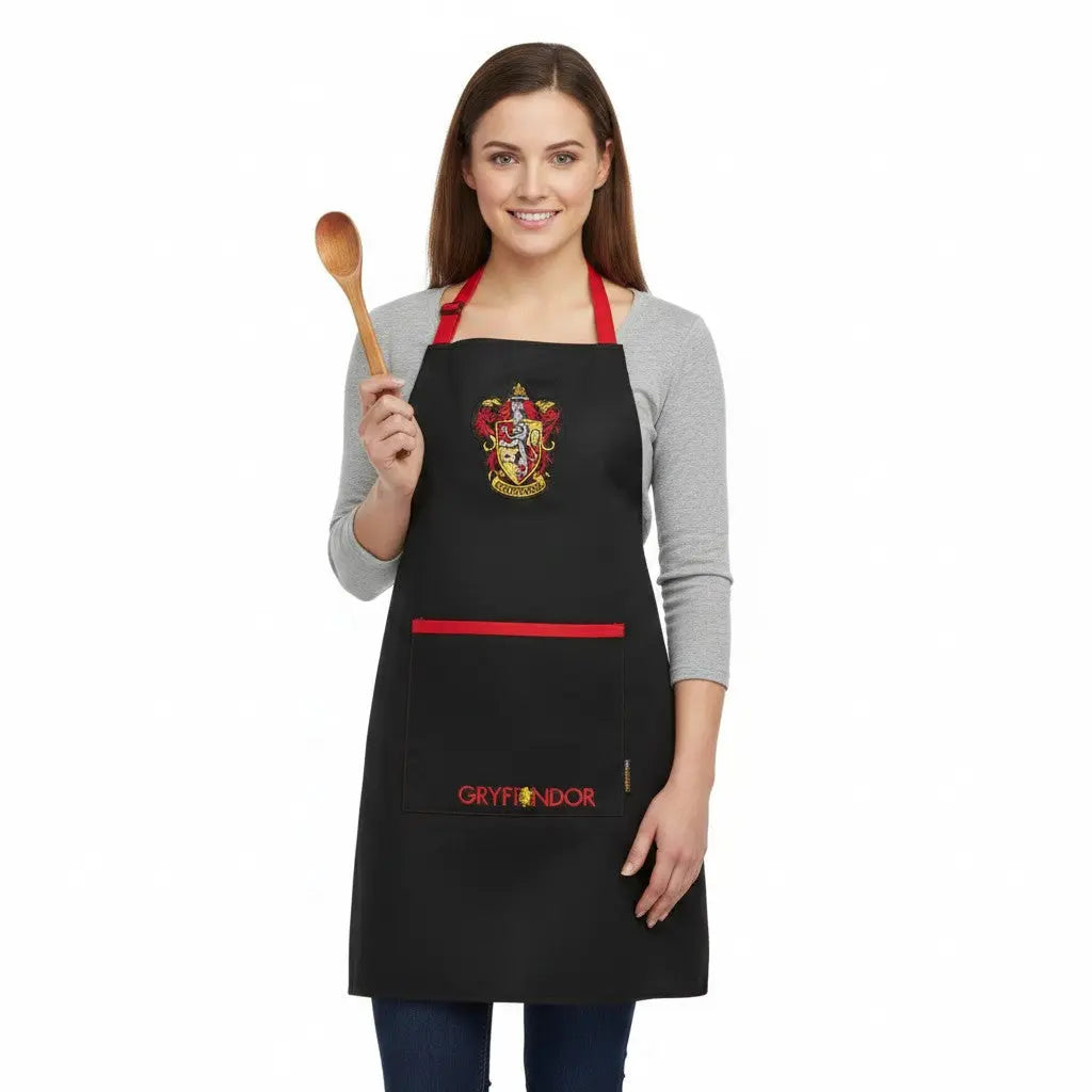 Tablier noir La boutique Aux 2 Balais Gryffondor Harry Potter en polyester et coton avec écusson et poche
