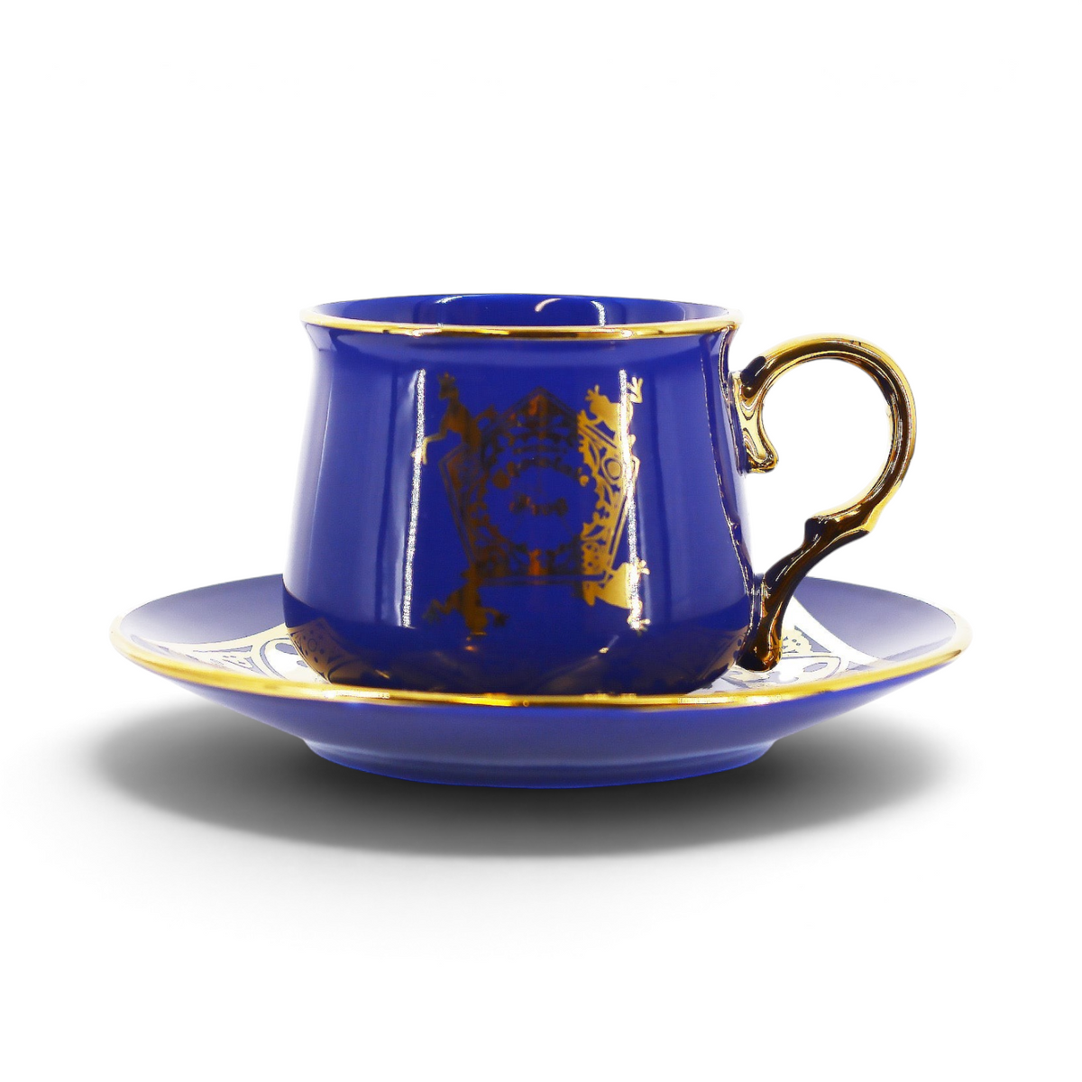 Service à thé La boutique Aux 2 Balais Harry Potter, tasse et soucoupe en porcelaine bleu roi avec détails dorés.